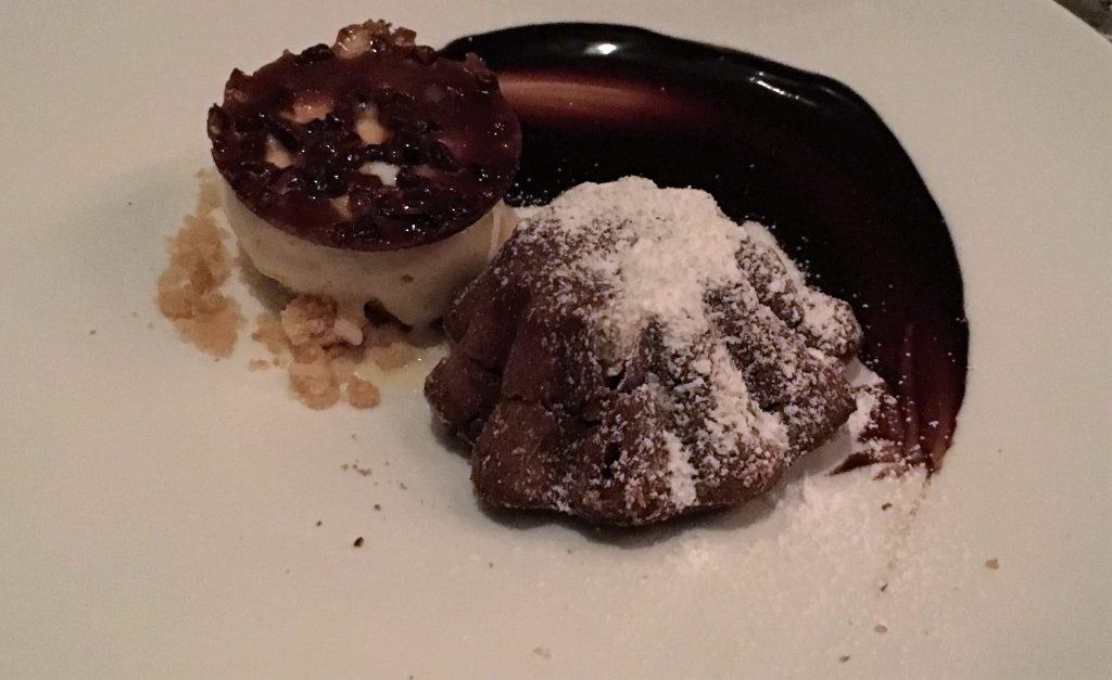 Chocolate cake and vanilla ice cream topped with caramelized crust