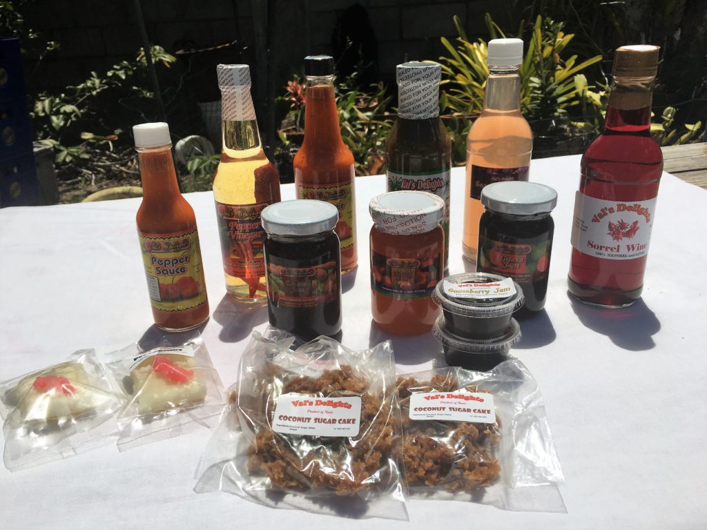 Selection of items from Vals Delights including sugar cakes, jams, jellies, and hot sauce