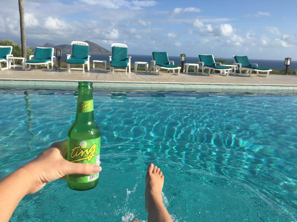 Drinking Ting, the local grapefruit soda, during a morning swim in Mount Nevis hotel pool.